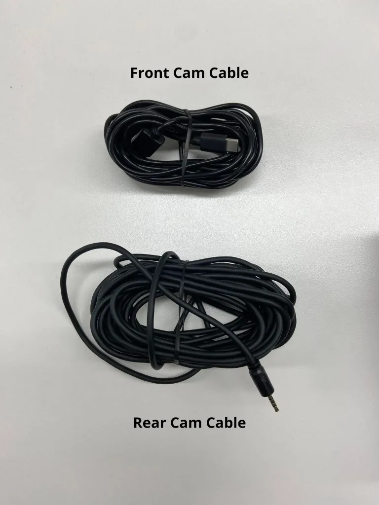 DDPAI dash cam cables with shorter cable for front cam and longer cable for rear cam connection displayed.